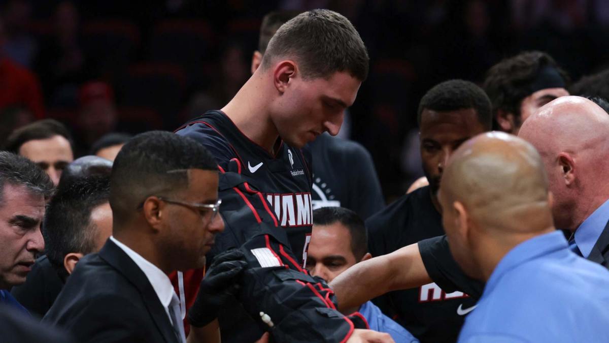 Miami Heat forward Nikola Jovic (5) exits the game with an apparent arm injury against the Toronto Raptors during the first quarter at Kaseya Center.